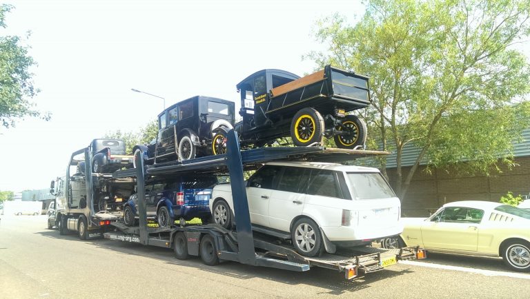 Multi-car transporter delivering to ShipMyCar 1