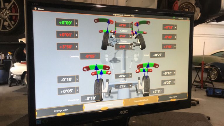 Car on wheel alignment rig