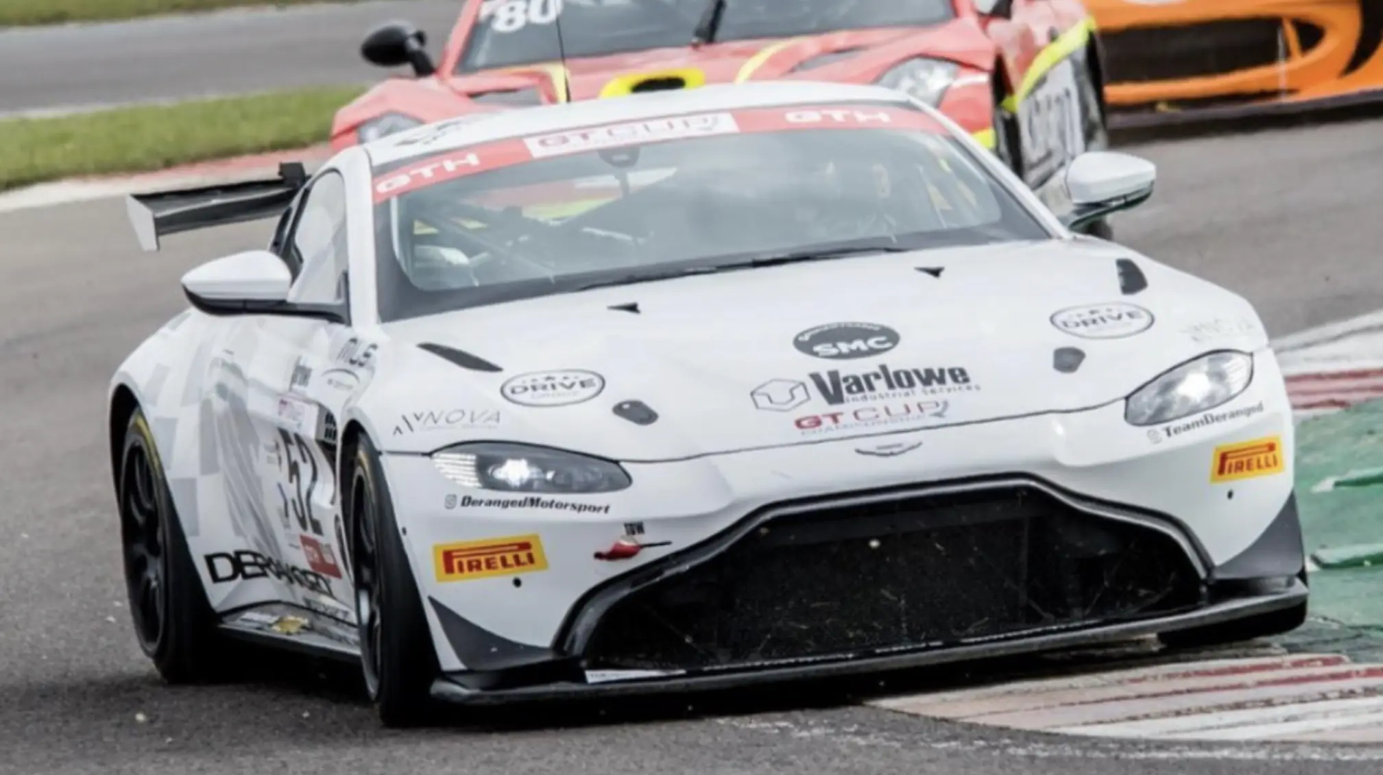 Logistics team coordinating the shipping of racing vehicles in the UK.